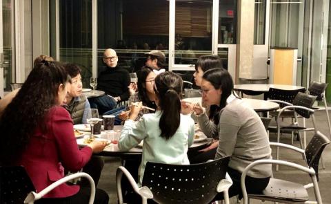 People chatting around a table