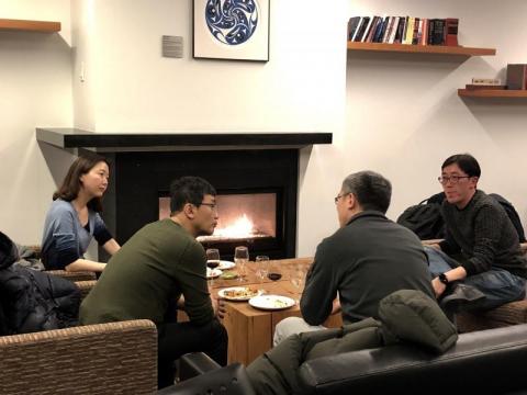 People chatting around a table