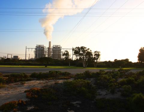 Coal power plant with smoke coming out the top