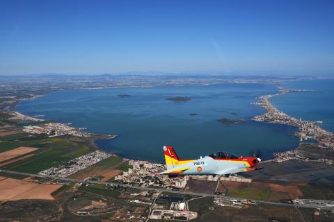 Aerial image of the Mar Menor Lagoon in Murcia Spain with a small two-seater aeroplane in the foreground.