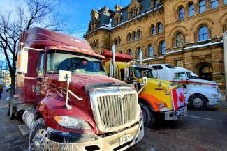 Photo of trucks gathered in downtown Ottawa as part of the Freedom Convoy.