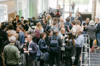 Conference participants mingling 