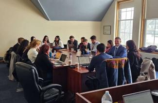 Gavin Cazon Wilkes, front with beaded jacket, facilitates the MacKenzie River Basin Table