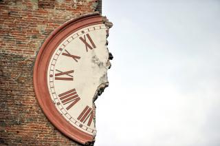 Half of a clock on building ruin