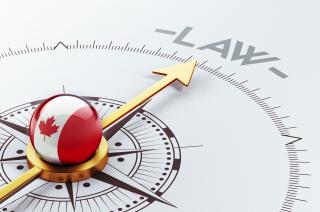 Canadian compass pointing to the word "LAW"
